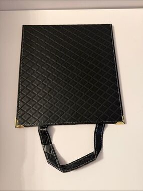 Black Quilted Travel Mirror with Gold Corner Accents and safety film on.